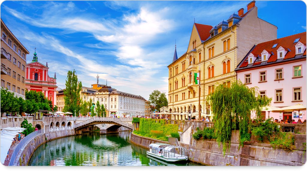 Ljubljana Castle perched above the city, overlooking terracotta rooftops and charming streets below.