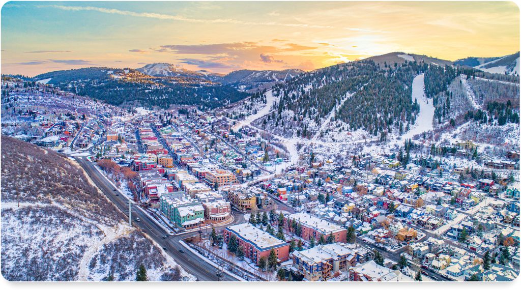 A panoramic view of skiers descending the powdery slopes of Park City Mountain Resort.