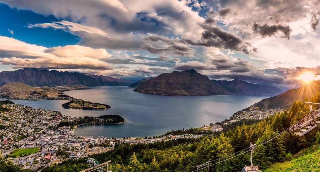 Overlooking Queenstown’s alpine townscape nestled by a winding lake and dramatic peaks.