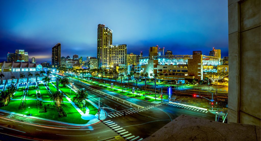 City streets and illuminated buildings in San Diego’s Gaslamp Quarter at dusk