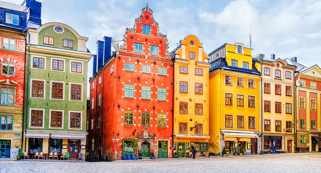 Historic facades in Stockholm’s central square lined with cafes