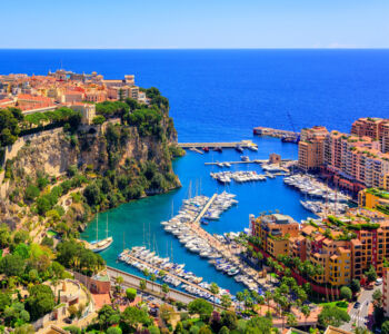 Aerial view of Monaco harbor and marina beside cliffside old town