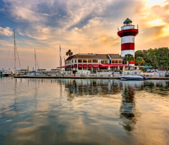 Harbor lighthouse and marina at sunset on Hilton Head Island