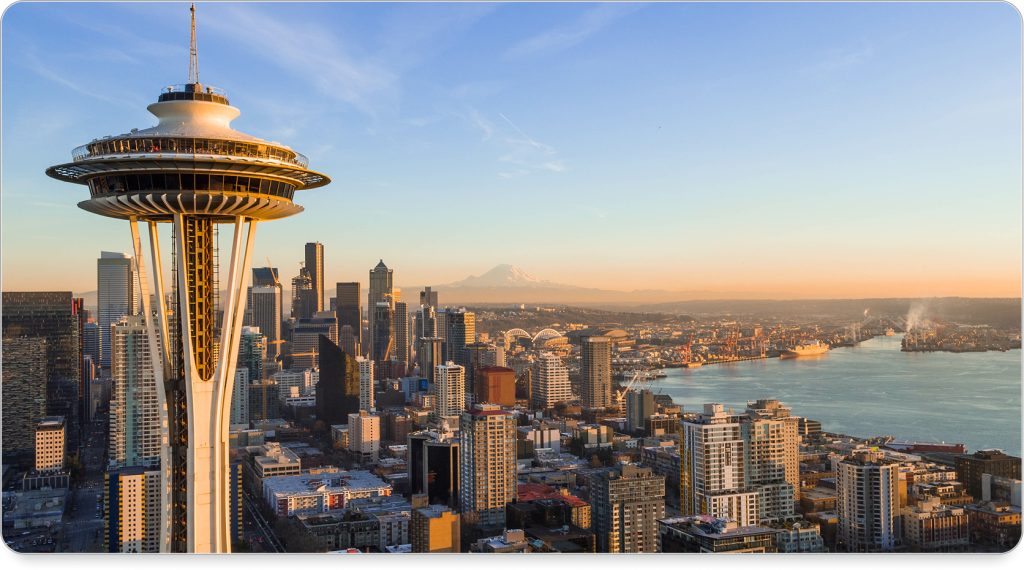 Cozy Seattle hotel room with warm lighting and Puget Sound views