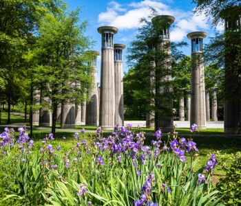 Garden flowers and tall concrete pillars at Bicentennial Capitol Mall State Park.