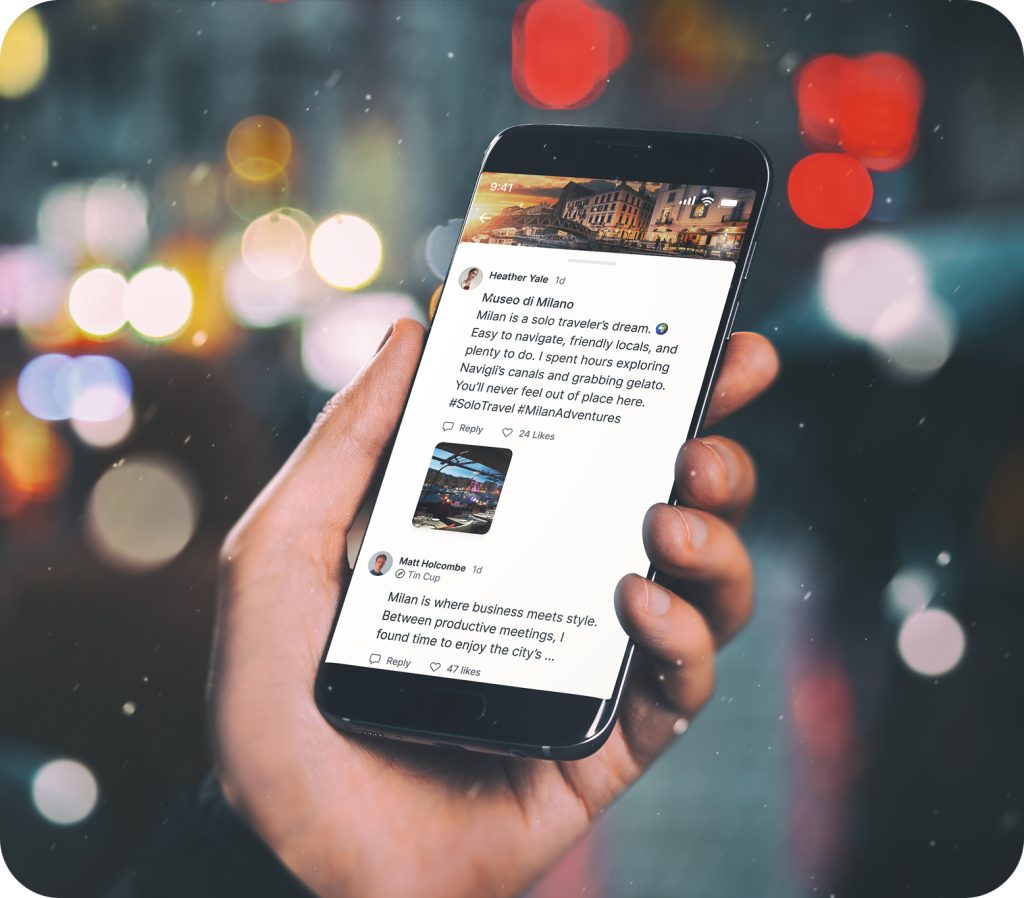 Mobile phone displaying Foresyte’s travel discovery feed with social-style posts highlighting peer reviews and local recommendations, held in hand with vibrant city bokeh in the background.