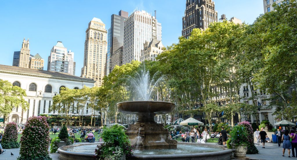 Bryant Park with New York Public Library and city skyline in the background
