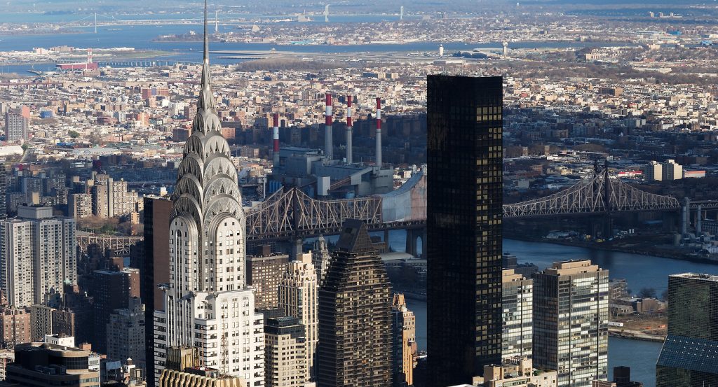 Close-up view of Chrysler Building’s Art Deco spire against the New York City skyline