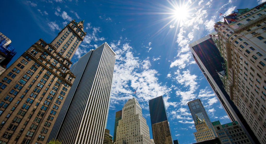 Skyscrapers along Fifth Avenue in New York City on a sunny day