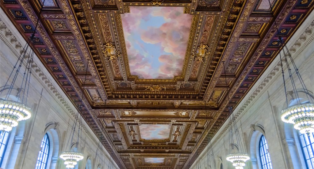 Painted ceiling and chandeliers inside the Rose Main Reading Room
