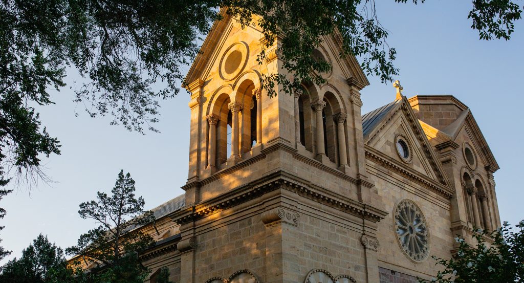 Sunset glow on St. Francis Cathedral overlooking Santa Fe Plaza