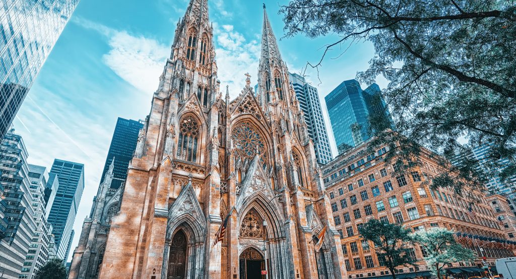 St. Patrick’s Cathedral exterior framed by Midtown skyscrapers