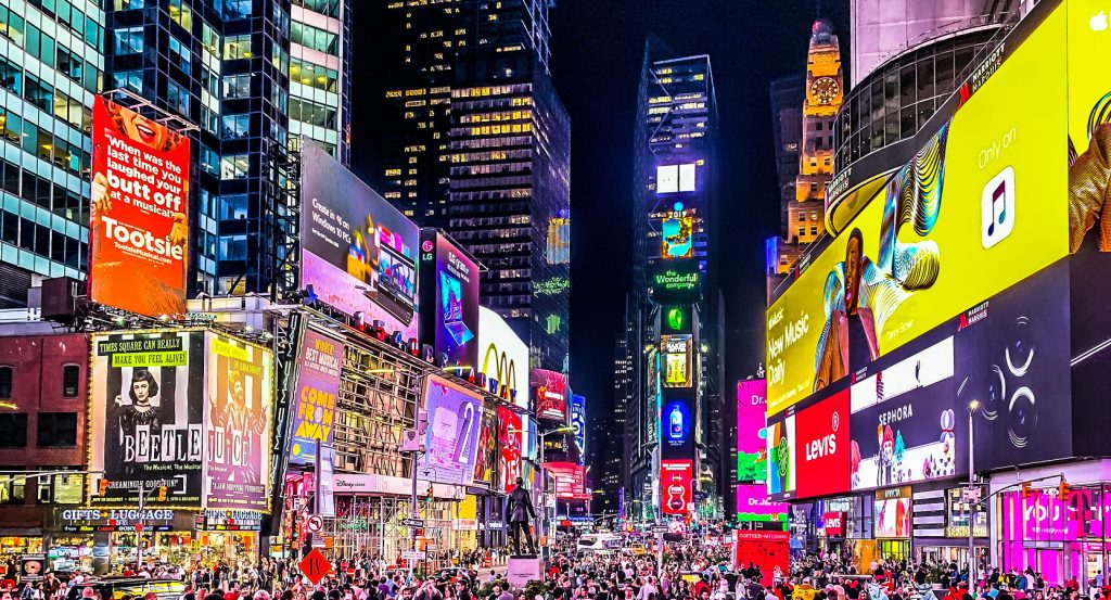 Times Square during the day with tourists and street performers