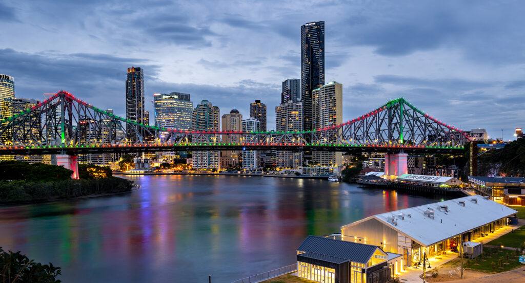 Riverside view of Howard Smith Wharves with Story Bridge illuminated in the background