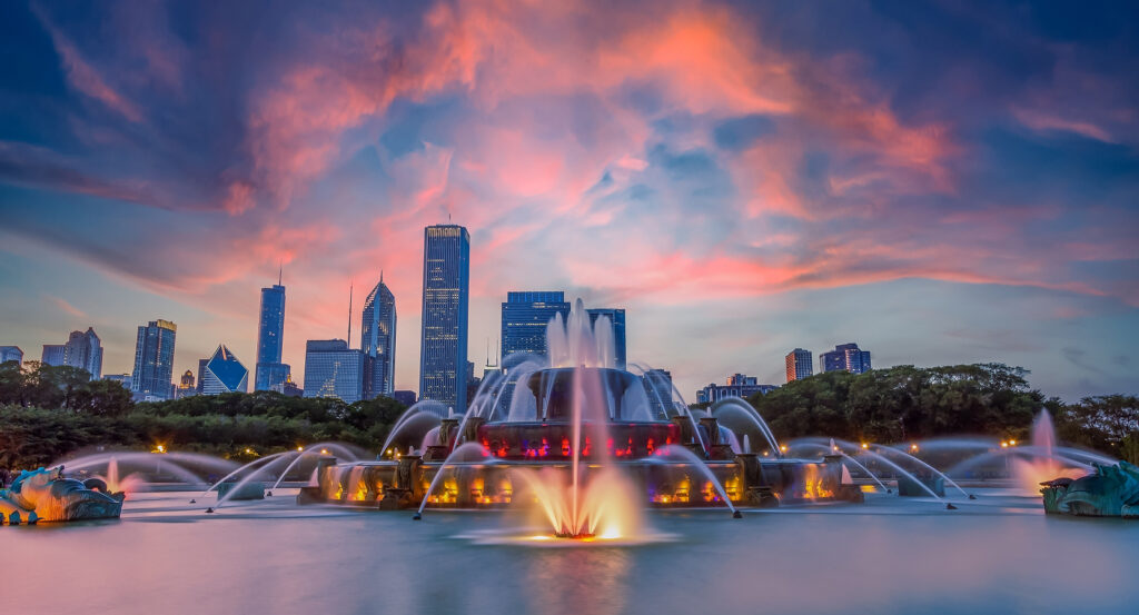 Night view of Buckingham Fountain illuminated with colorful lights in Grant Park