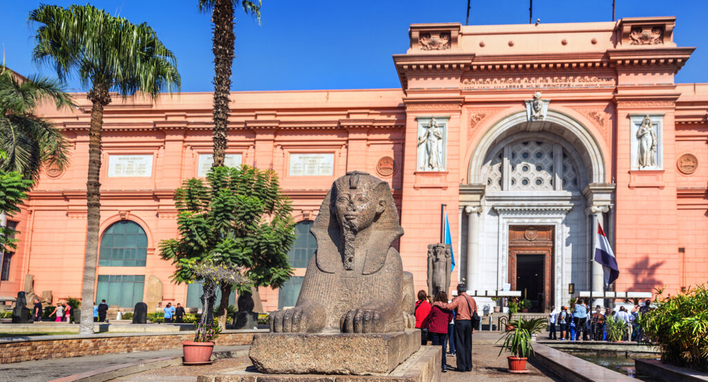 Egyptian Museum facade in Cairo with visitors entering