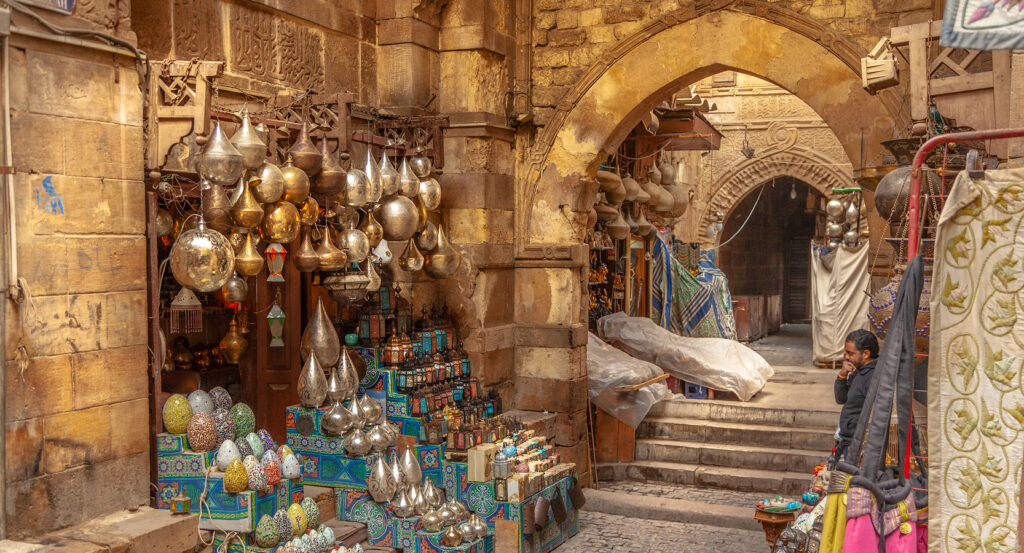 Brass lamps and arches inside Cairo’s Khan el-Khalili bazaar