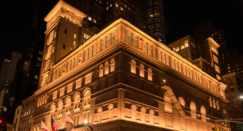 Orchestra performing on stage at Carnegie Hall in New York City