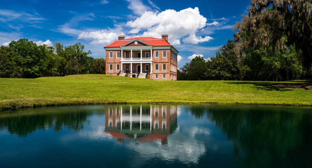 Exterior of Drayton Hall with red roof and brick facade in Charleston