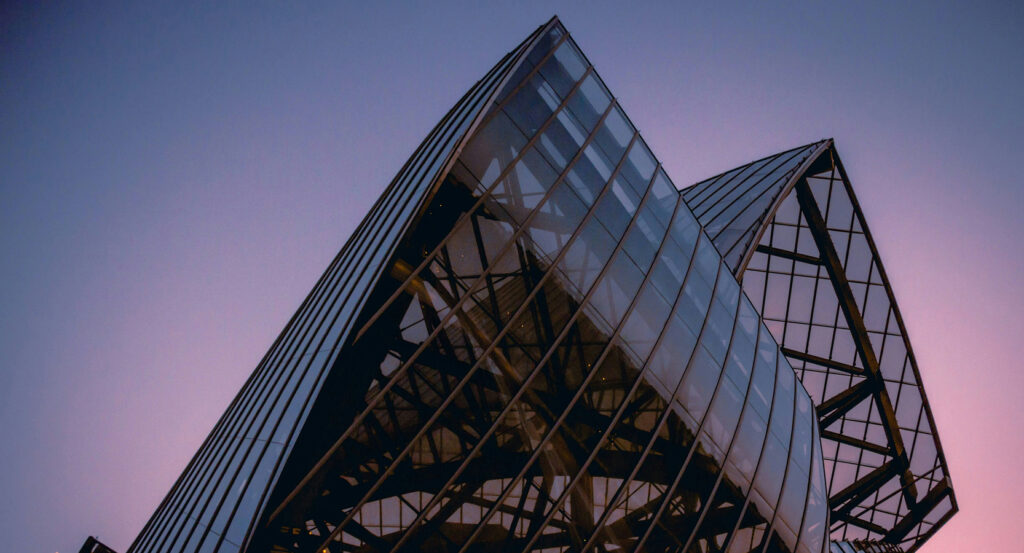 Modern glass sails of Fondation Louis Vuitton at sunset in Paris