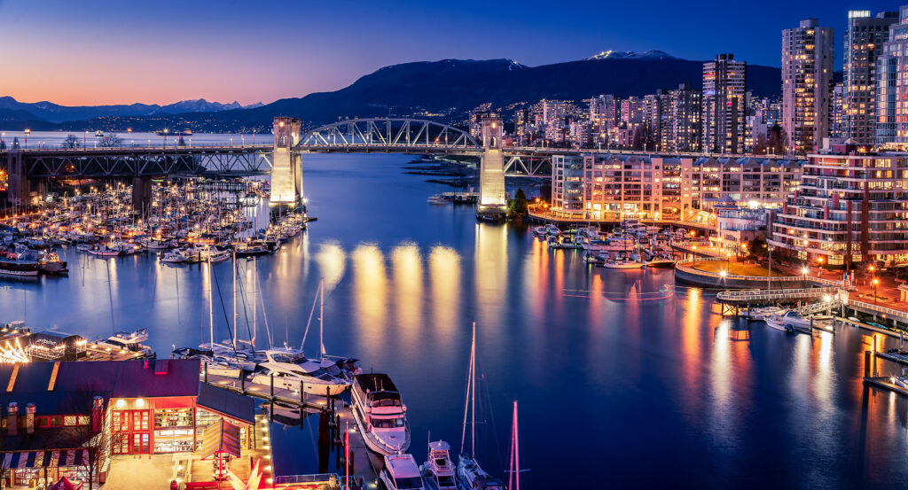 Market lights reflecting on the waterfront at Granville Island in Vancouver