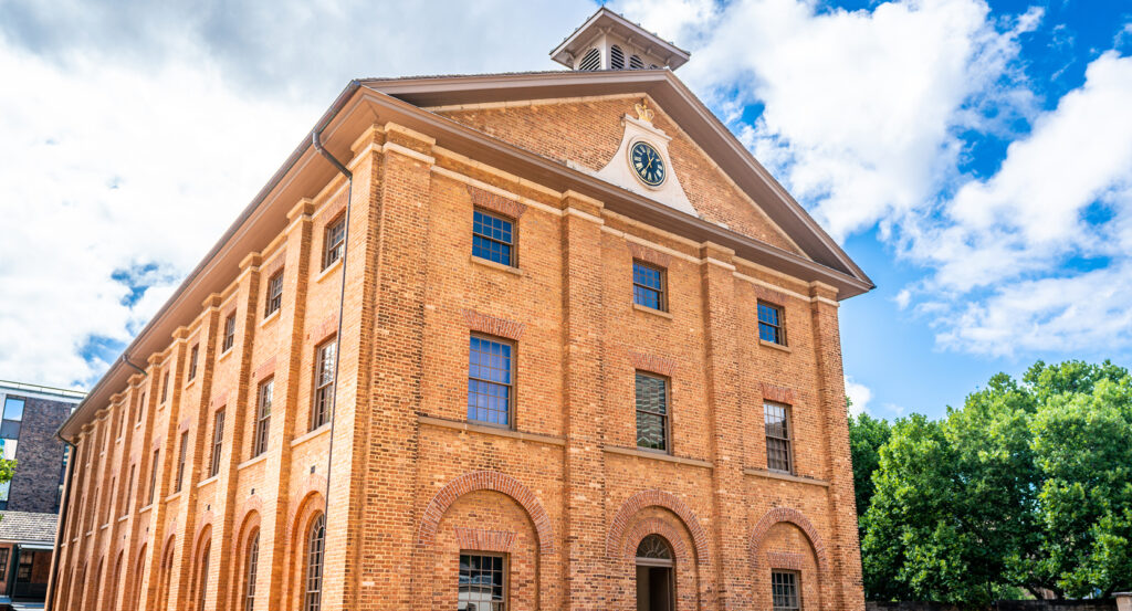 Historic convict-era Hyde Park Barracks with brick facade in Sydney