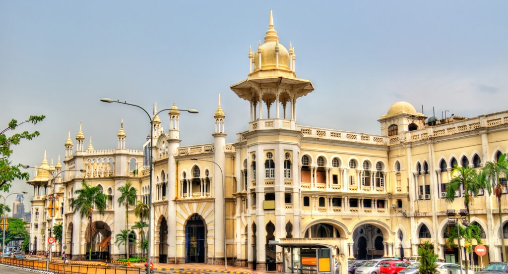 Historic architecture of Kuala Lumpur Railway Station under bright sky