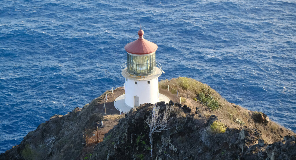 Honolulu's Makapuʻu Point Lighthouse with cliffs and ocean views