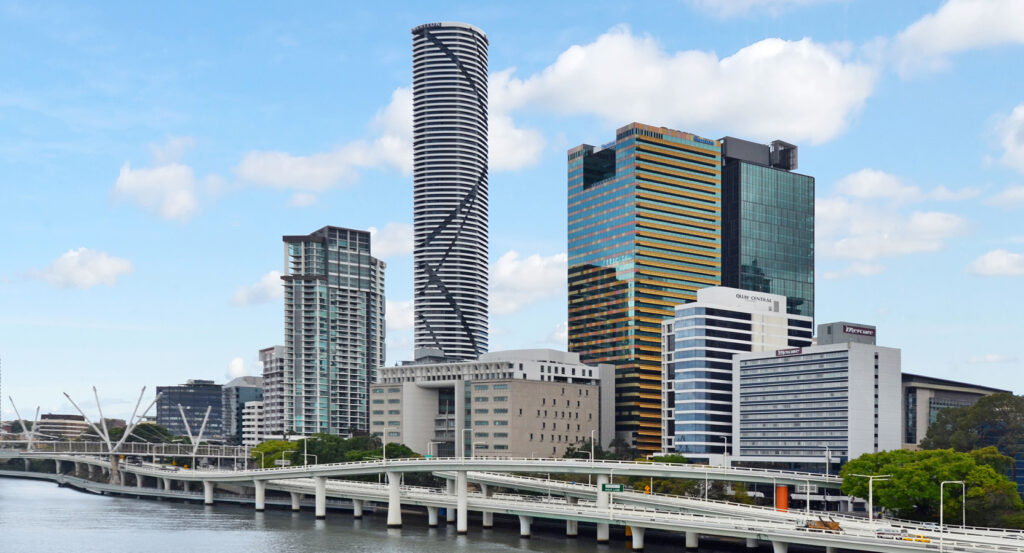 Infinity Tower with its spiral façade rising over the Brisbane riverfront