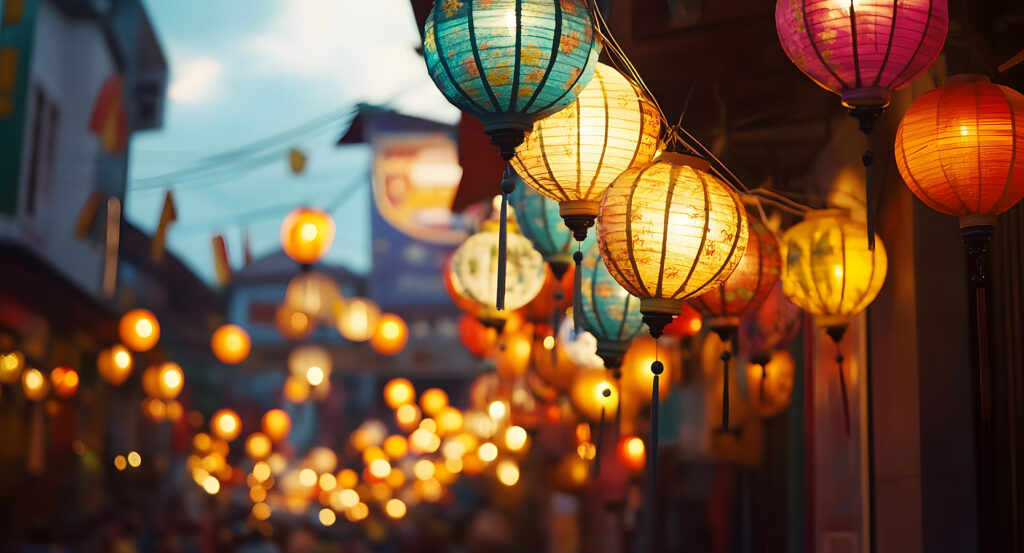 Crowds walking under glowing lanterns at Petaling Street Kuala Lumpur