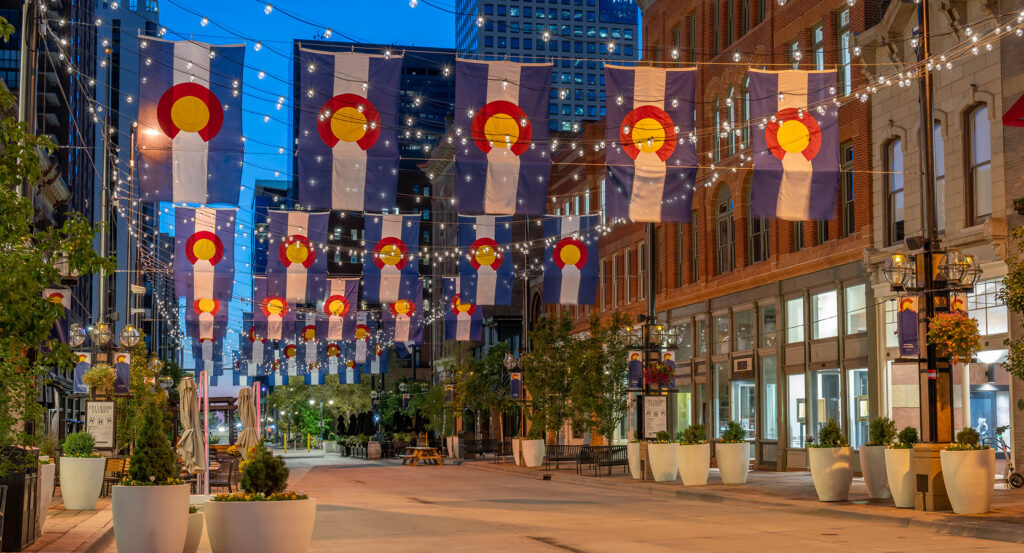 Larimer Square at night with flags and string lights