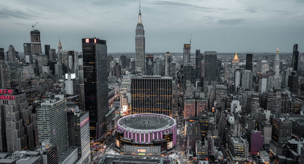 Night view of Madison Square Garden lit up during a concert