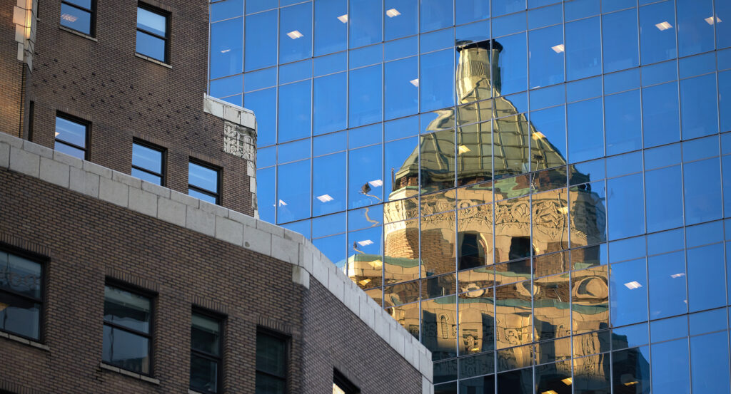 Reflection of Marine Building in glass skyscraper in Vancouver