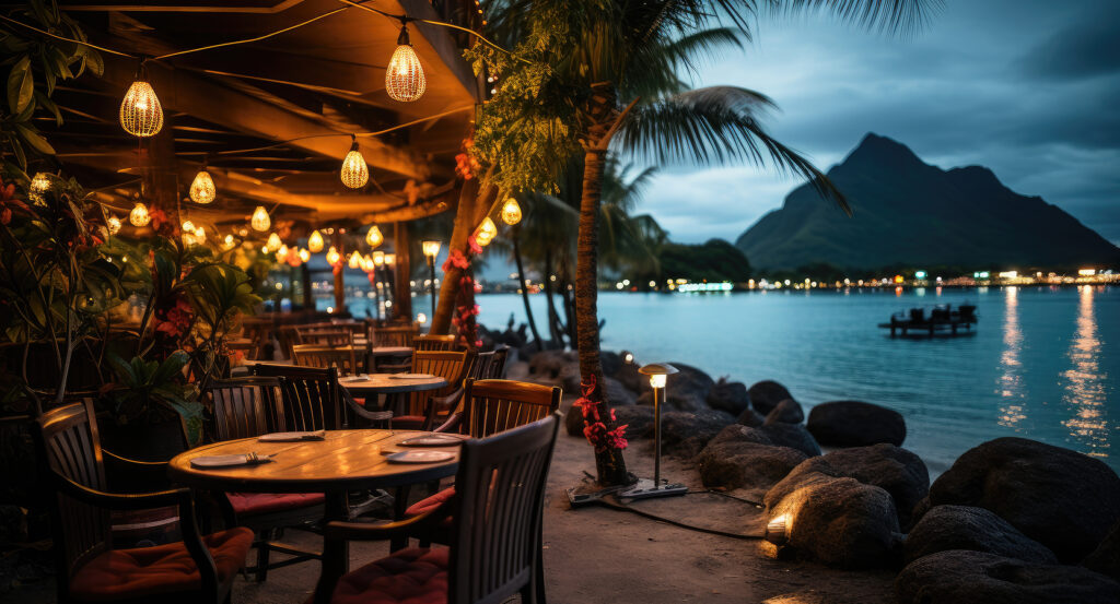 Lagoon waters and dining setup along Matira Beach at dusk in Bora Bora