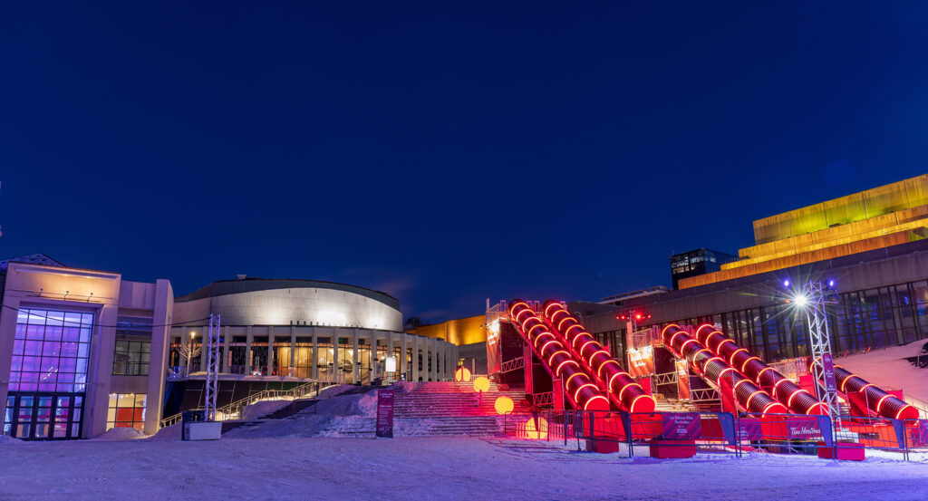 Exterior view of Place des Arts plaza in Montreal illuminated at night