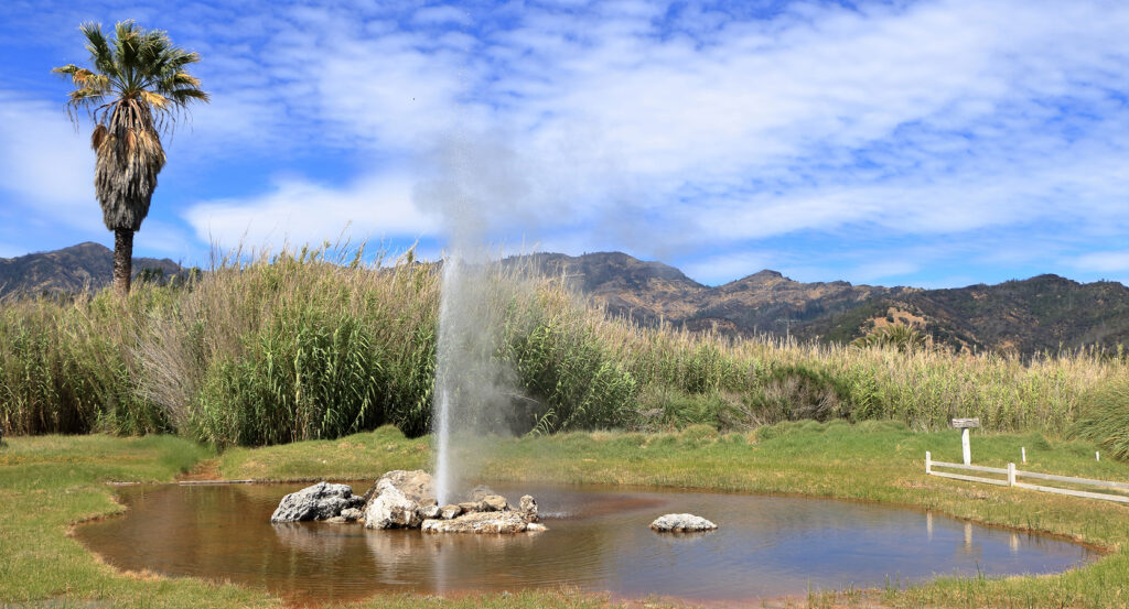 Scenic geyser eruption with mountains in Napa Valley