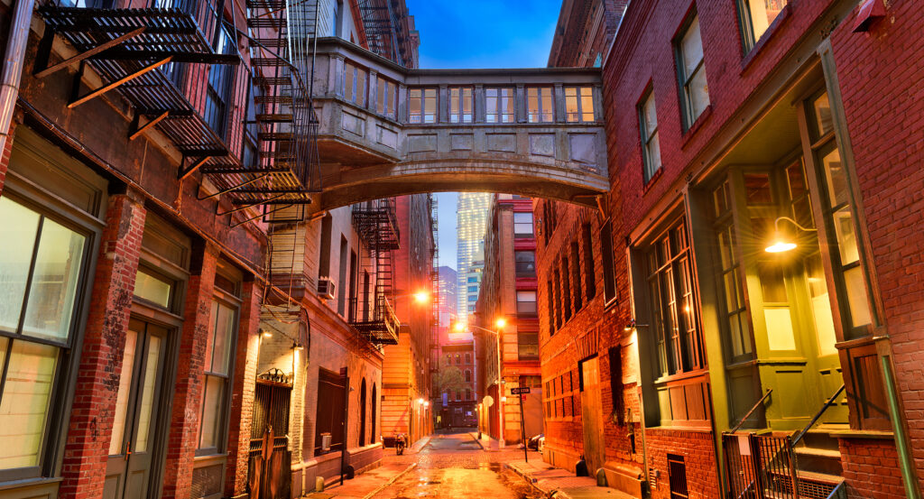 Evening lights shining through Tribeca’s cast-iron buildings