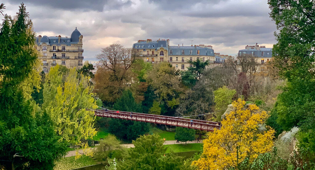 Rocky cliffs and greenery in Parc des Buttes-Chaumont Paris