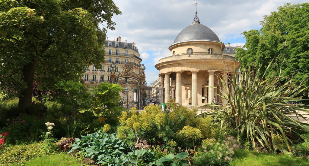 Pavilion and ornate gates of Parc Monceau in Paris on a sunny day