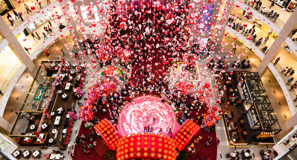 Interior of Pavilion Kuala Lumpur mall with festive decorations and crowds