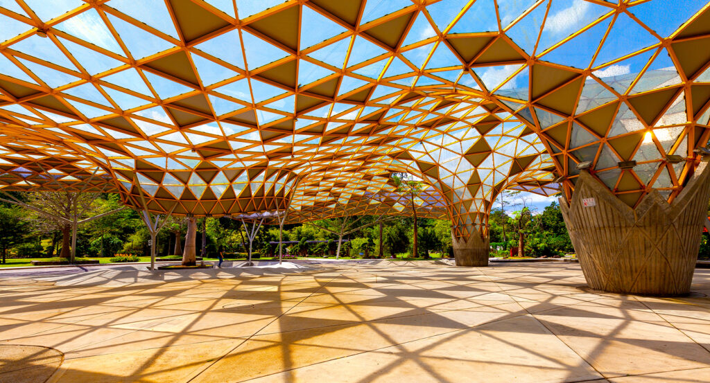 Visitors exploring lush greenery at Perdana Botanical Garden