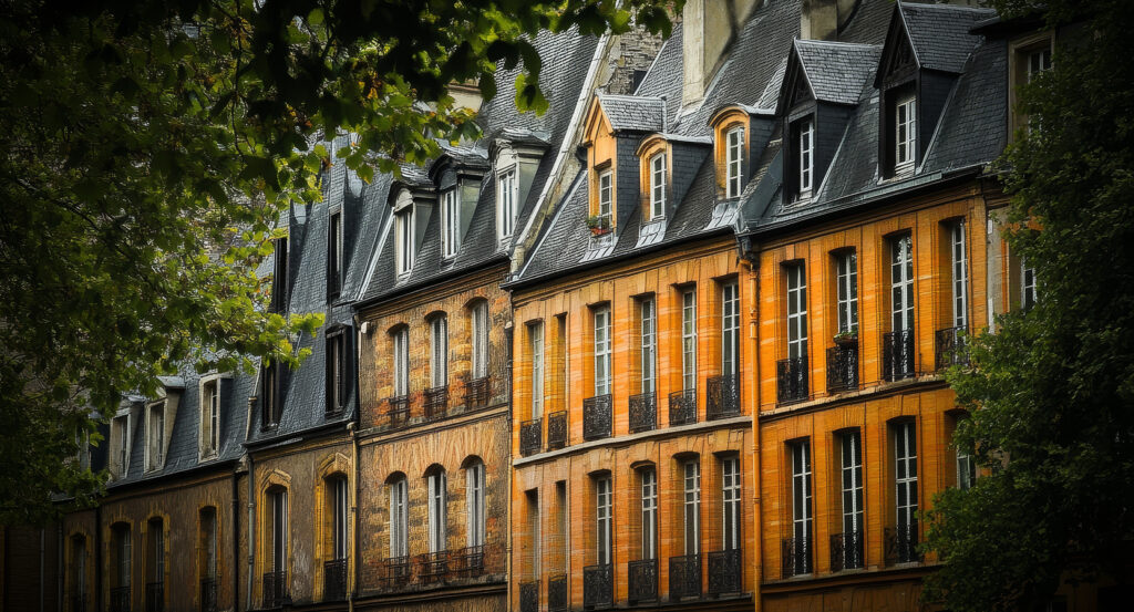 Central square of Place des Vosges with gardens and red brick facades