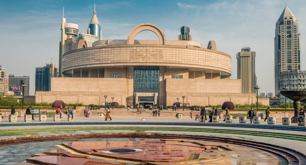 Shanghai Museum with visitors outside its round and square design