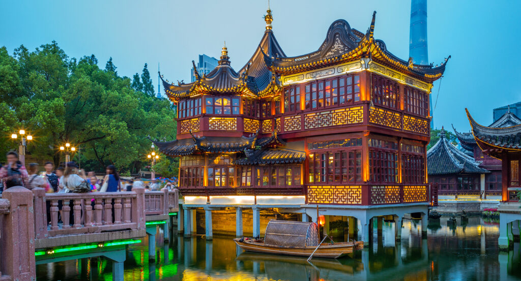 Traditional pavilion of Yu Garden over water in Shanghai