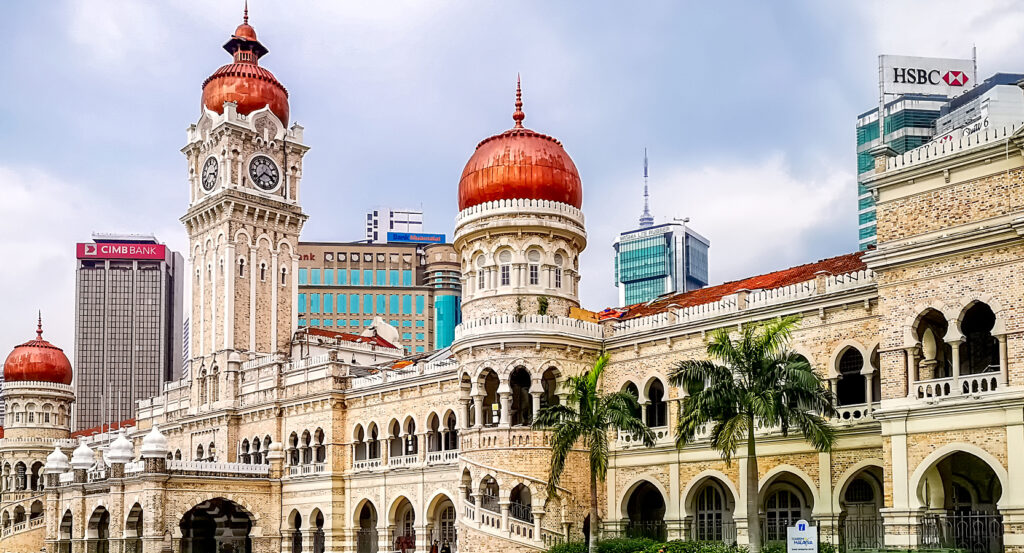 Clock tower of Sultan Abdul Samad Building against city skyline