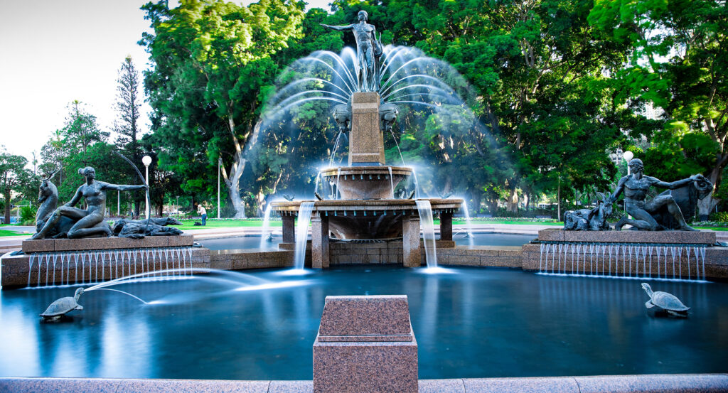 View of Hyde Park Sydney with fountain and statues