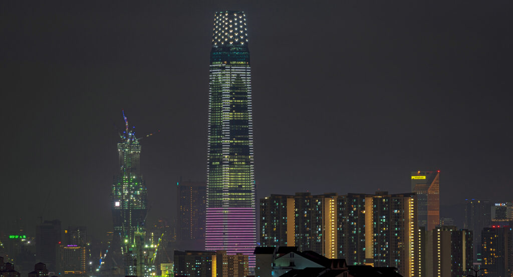 Exchange 106 tower rising above Kuala Lumpur with lights glowing at night