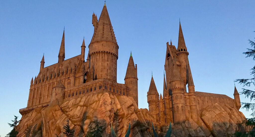 Main entrance to Universal Studios Hollywood with globe and visitors