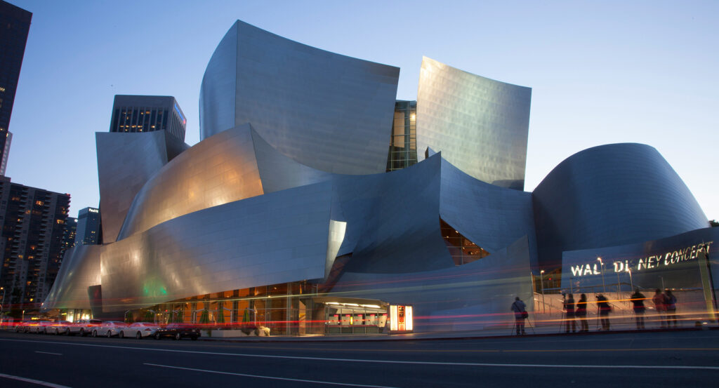 Interior of Walt Disney Concert Hall showcasing sweeping wood design and concert stage