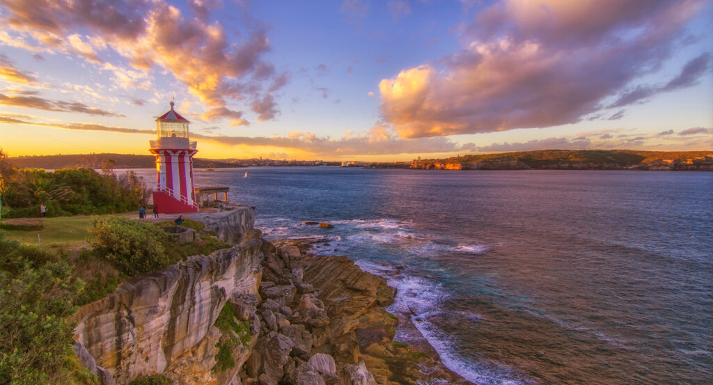 Rocky coastline and lighthouse at Watsons Bay overlooking the Pacific